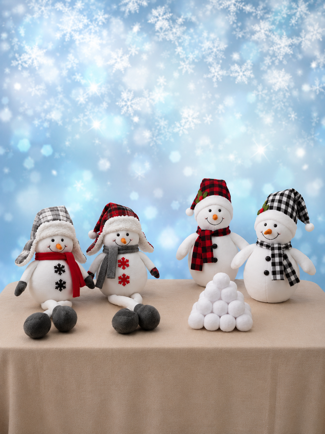 Winter portrait set with cheerful snowman plush figures, soft snowflakes, and a cool blue backdrop
